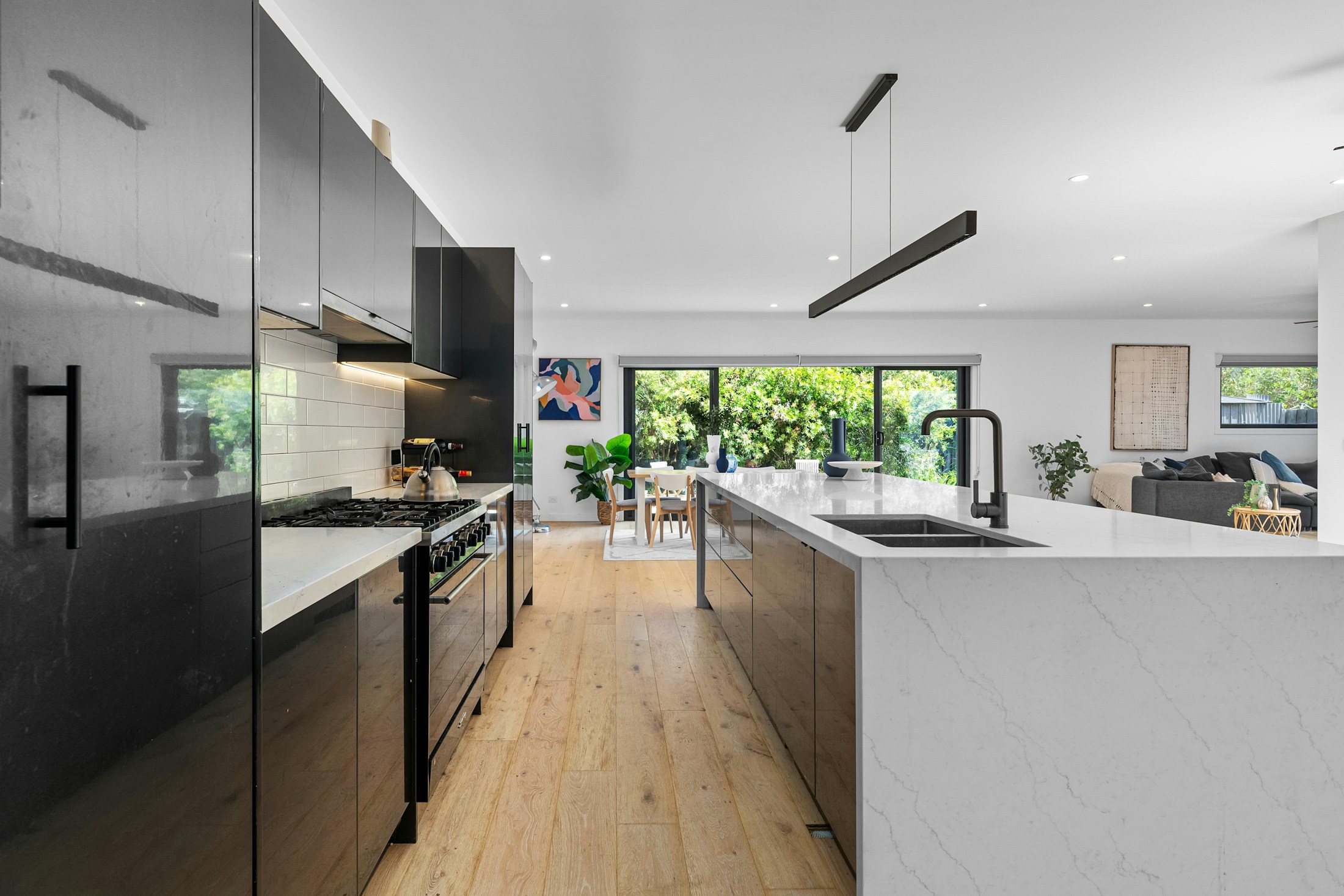 Bright home interior with wood floors and a welcoming kitchen